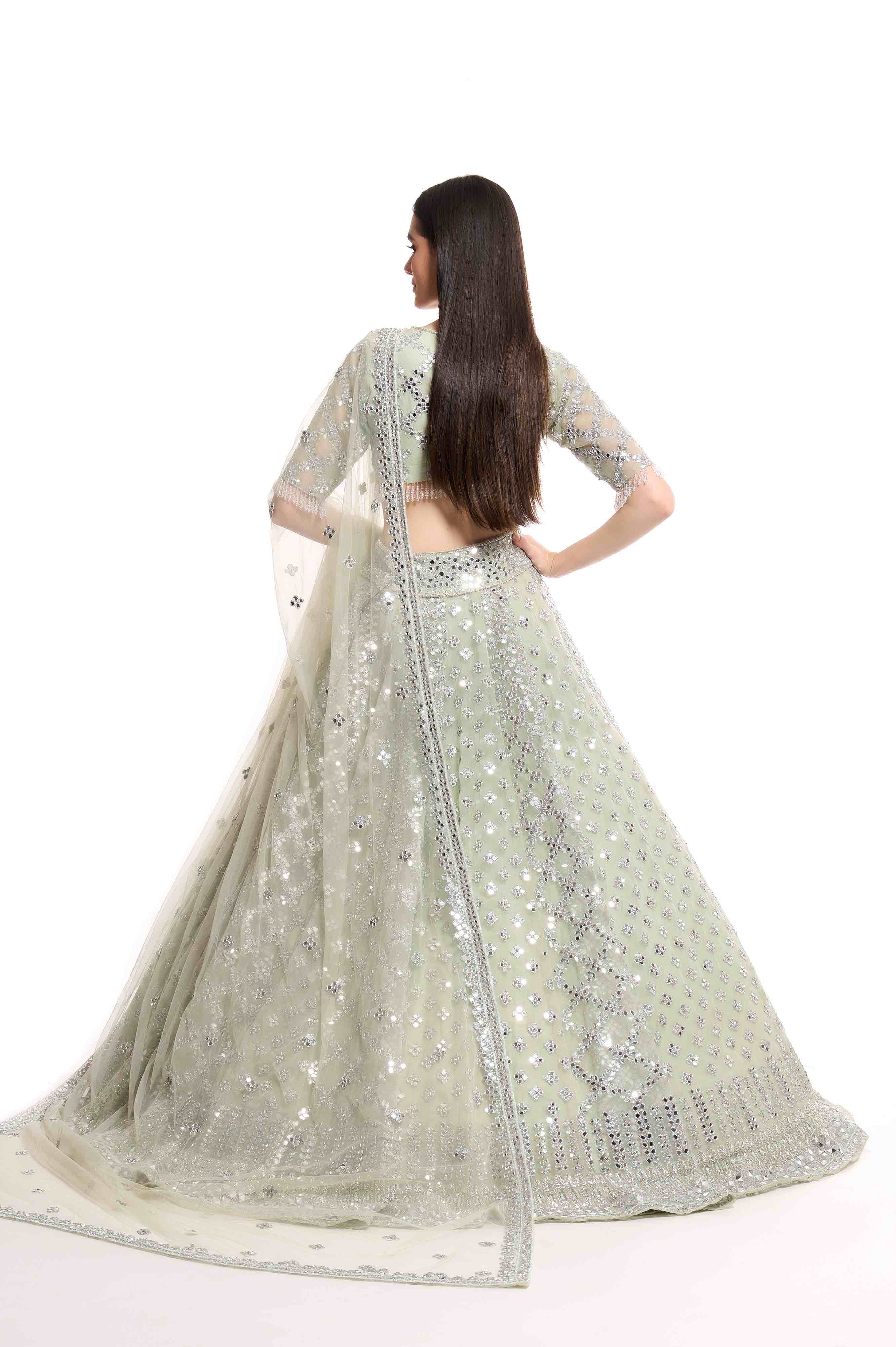 green lehenga with mirror work